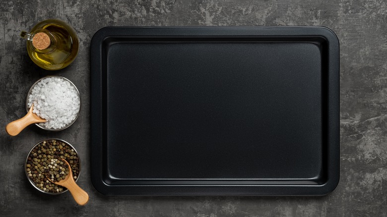 Empty sheet pan with oil, salt, and pepper