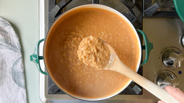 pumpkin pecan rice pudding in pot on stove