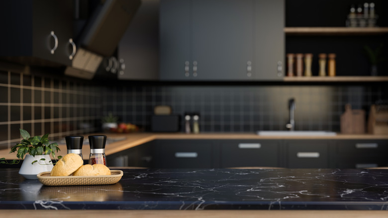 A cutting board on a soapstone countertop.