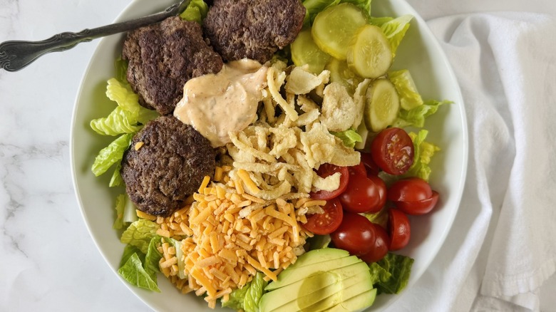 salad with burger patties