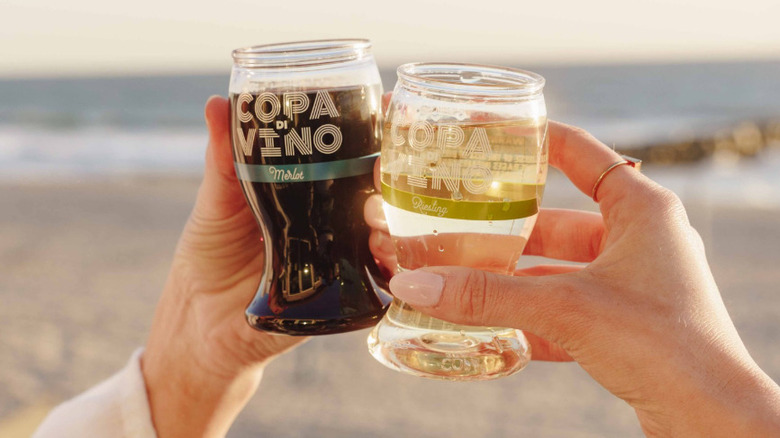 Hands toasting with Copa di Vino
