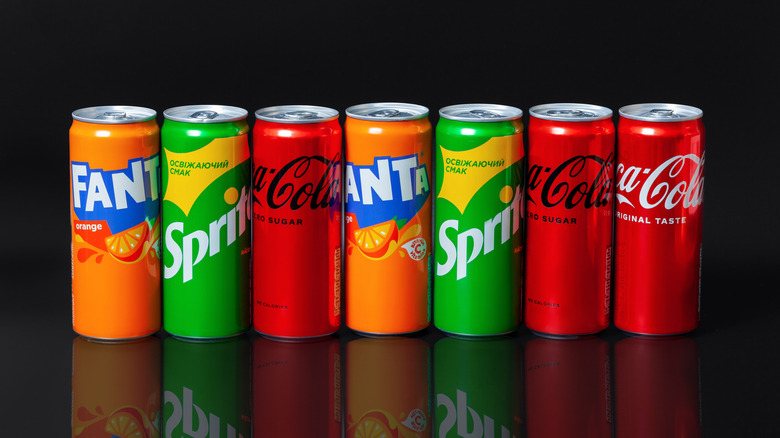 Cans of Coke, Fanta, and Sprite