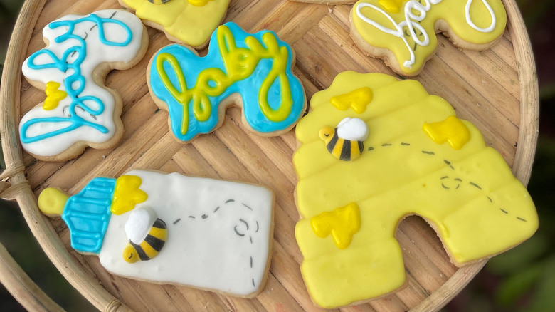 Edible candy bees on decorated cookies