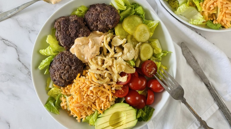 salad with burger patties