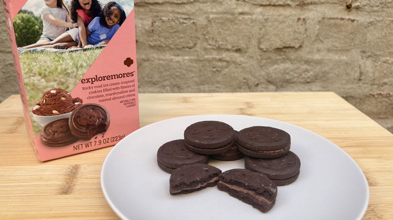 Plate of Exploremore Girl Scout sandwich cookies and box