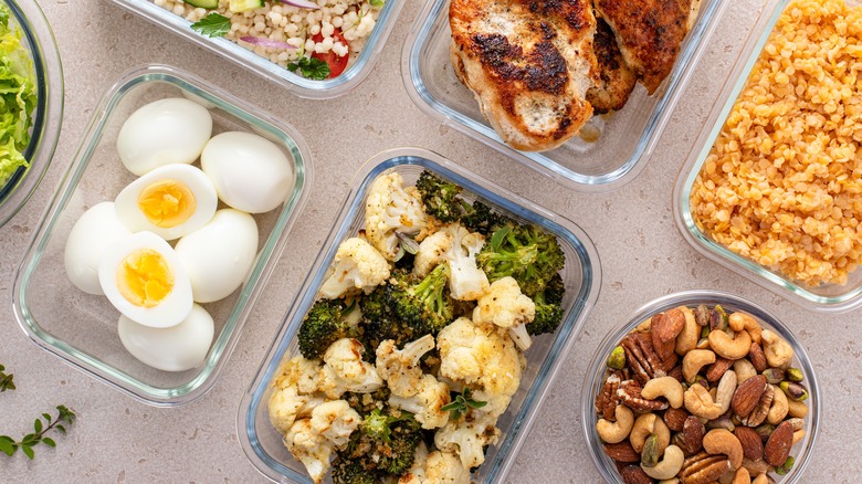A variety of meal prep, including roasted broccoli and cauliflower.