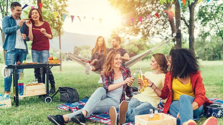 young people having cookout at public park
