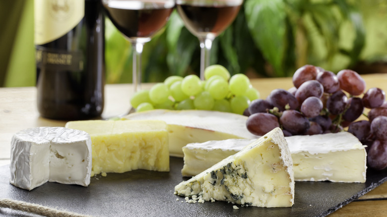 cheese with wine and grapes outdoor dining