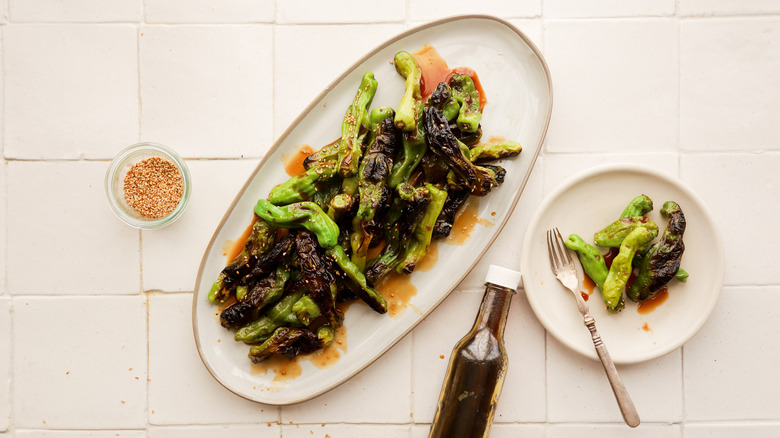 Plate of grilled shishito peppers