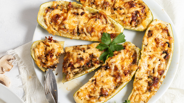 Cheesy Mushroom Zucchini Boats on a plate.