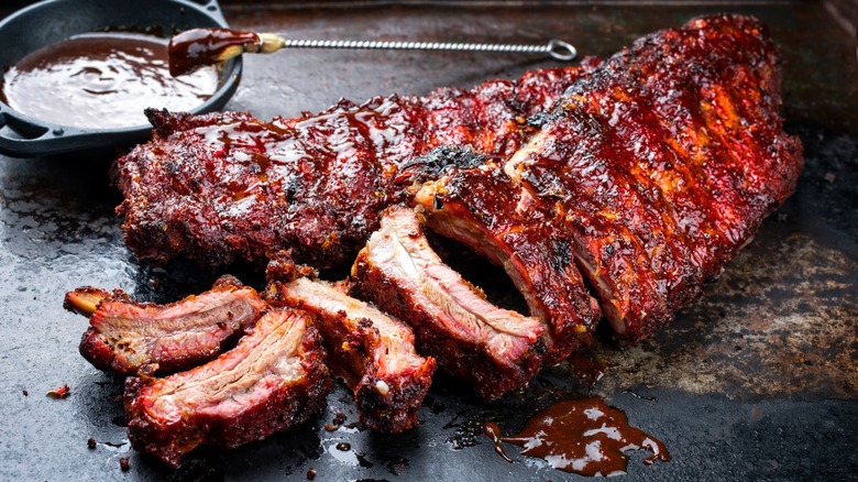 barbecue ribs alongside barbecue sauce