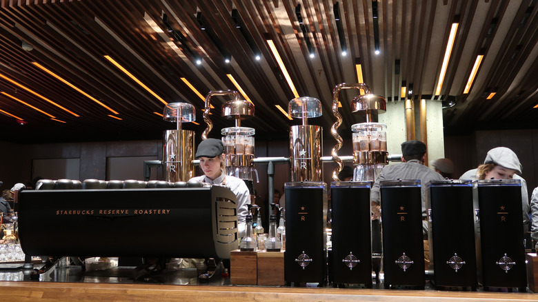 A barista working behind the espresso machine at a Starbucks Reserve