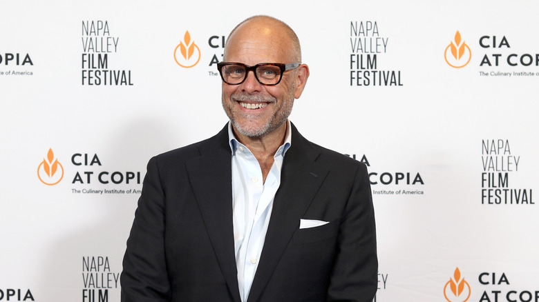 Alton Brown smiling at an event
