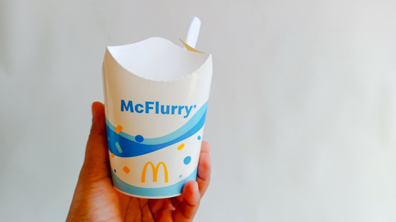 Hand holding a McFlurry cup