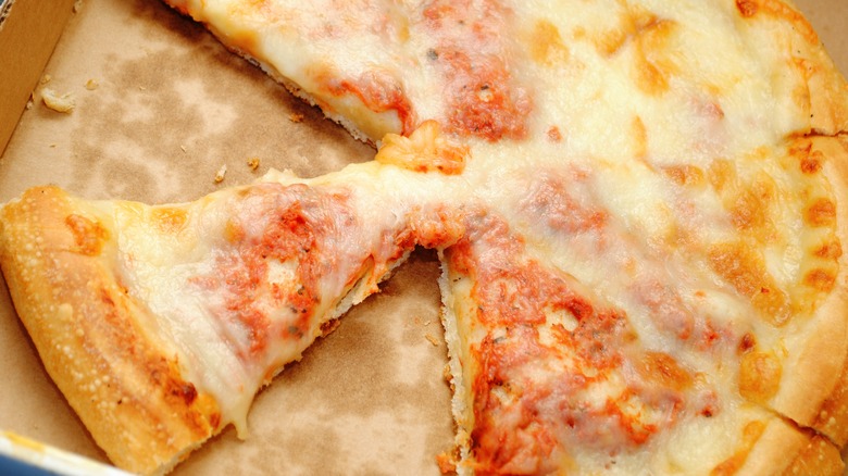 Leftover cheese pizza in pizza box