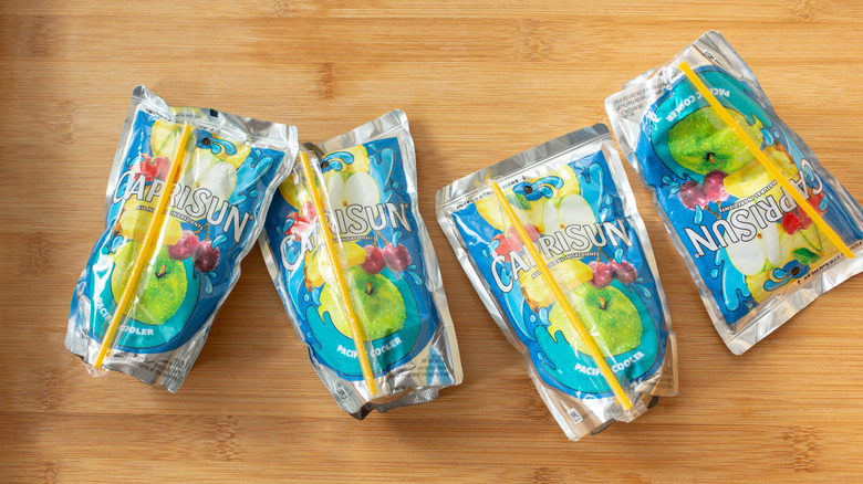 Pouches on a Capri Sun on a wooden table