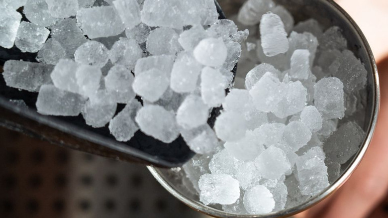 A close up photo of nugget ice being poured into a cup