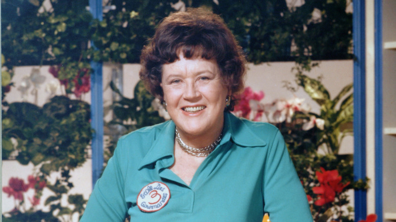 Julia Child smiling on the set of her TV show