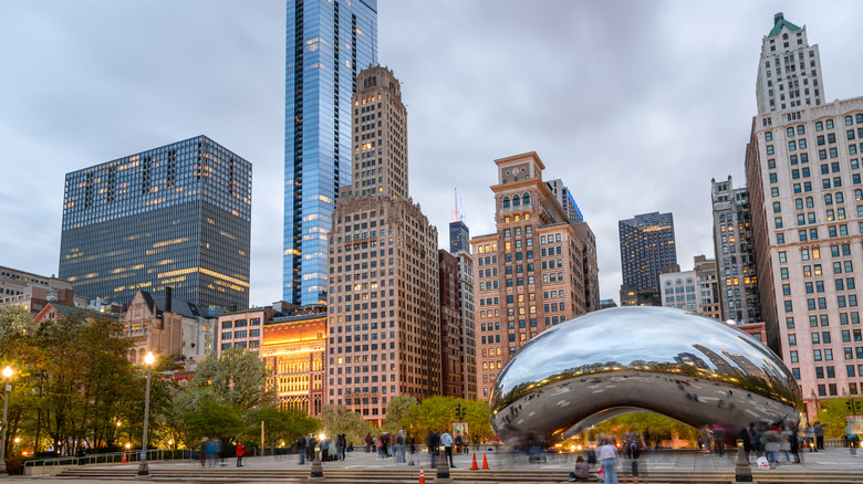 The Bean in Chicago sits in front of skyscrapers