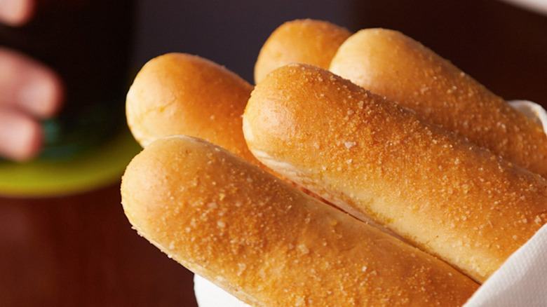 Olive Garden breadsticks wrapped in a napkin