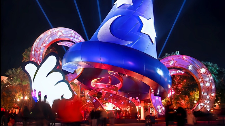 Disney Hollywood Studios Sorcerer's Hat attraction at night, lit up