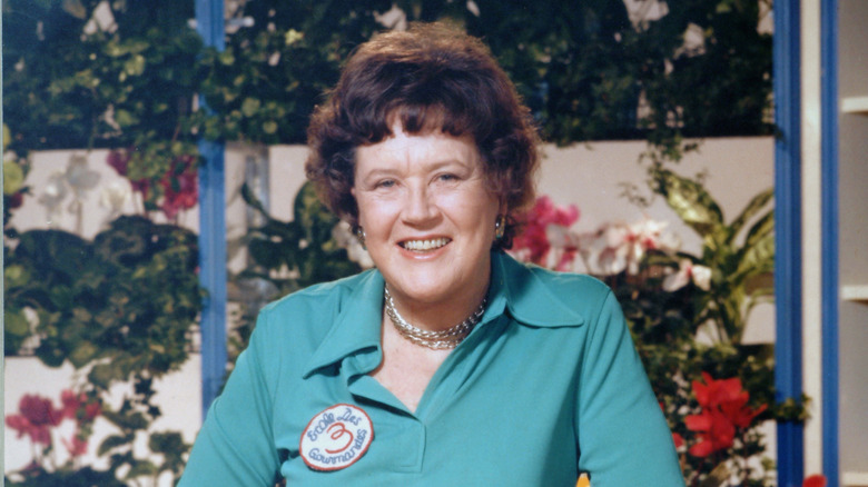 Julia Child smiling on a TV set