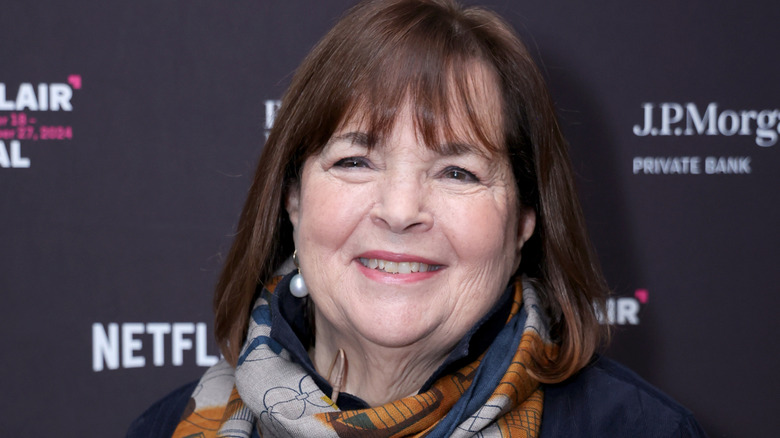 Ina Garten smiling on a red carpet