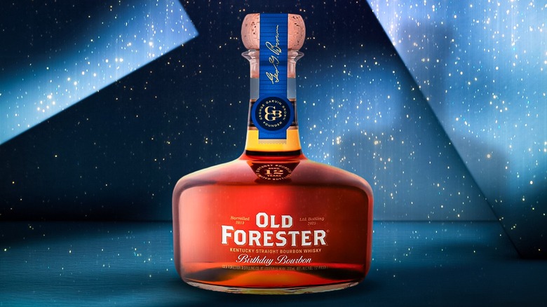 Old Forester Birthday Bourbon 2025 bottle on blue background