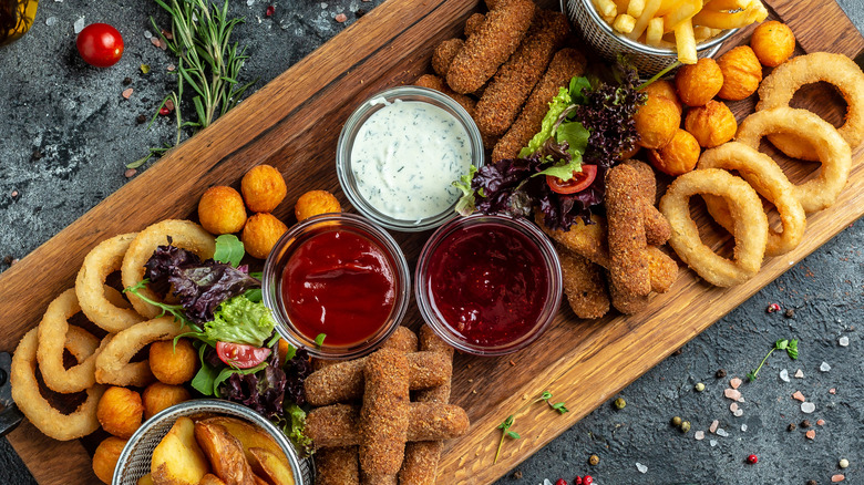 Fried appetizer platter with onion rings and fried cheese