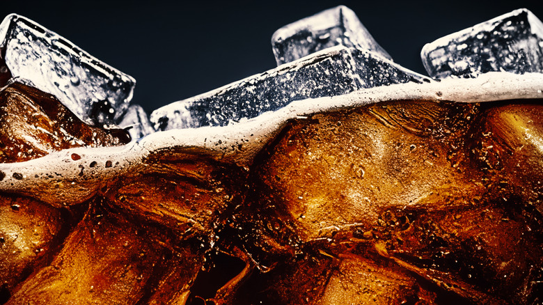 Closeup of ice floating in a soda