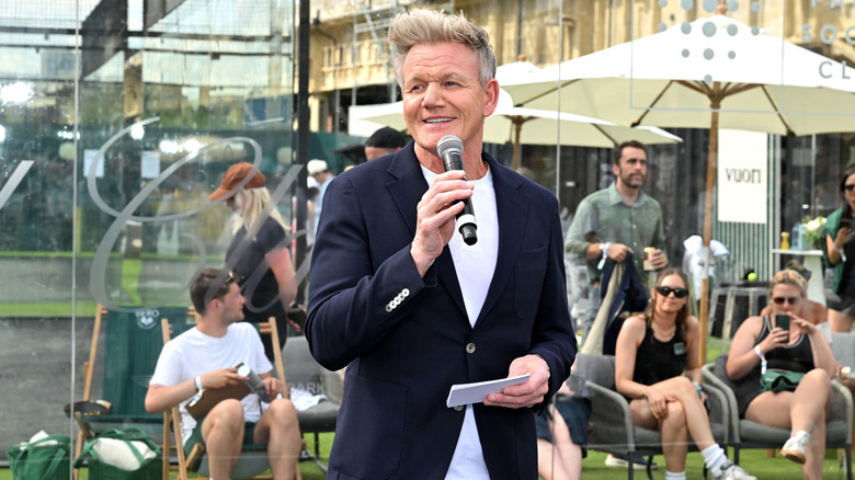 Gordon Ramsay smiles as he speaks at a public event