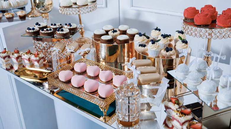 A variety of different vintage cakes displayed neatly on a table