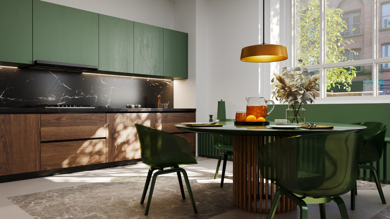 Cozy kitchen with green and wood cabinets