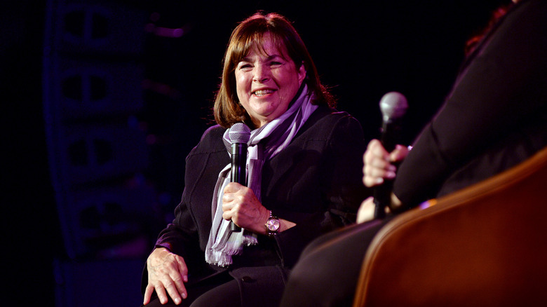 Ina Garten sitting on a stage next to someone with a microphone