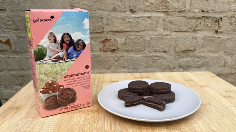 Plate of Exploremore Girl Scout sandwich cookies and box