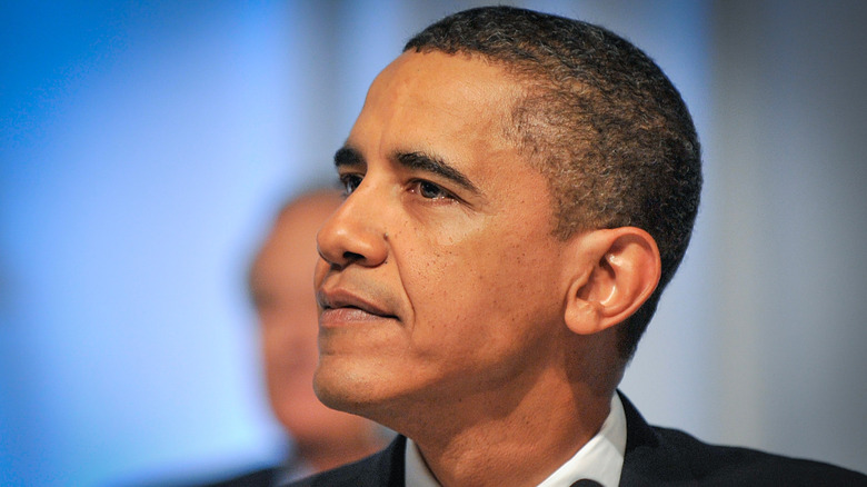 Headshot of Barack Obama with a somber expression