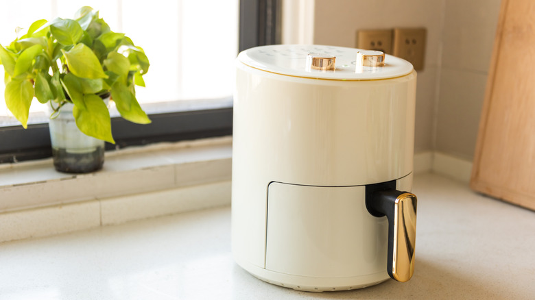 White air fryer sitting on a counter