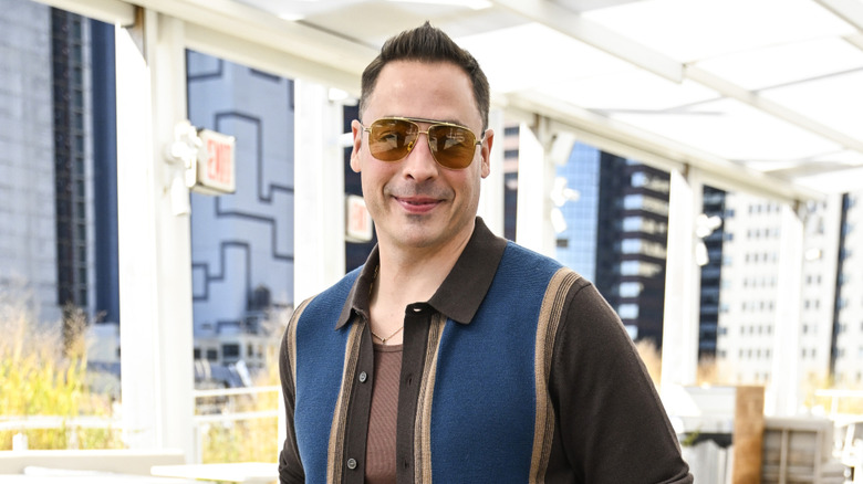 Jeffrey Mauro wears sunglasses and smiles