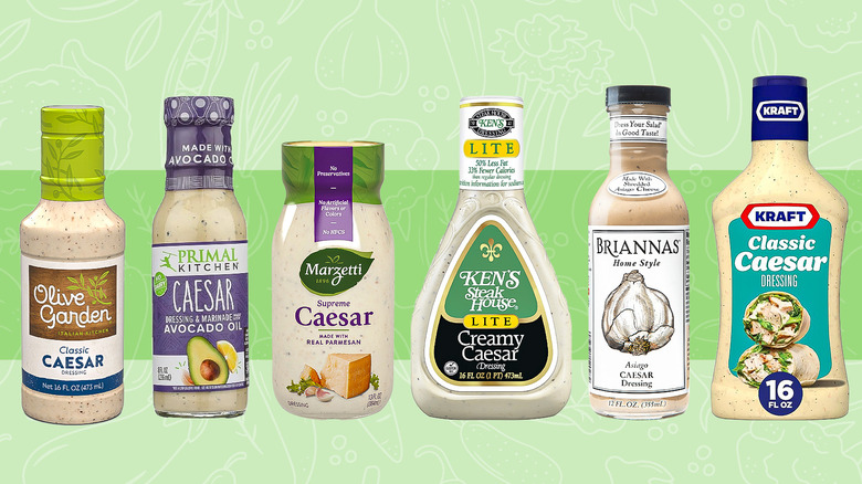 various bottles of caesar dressing on a green background