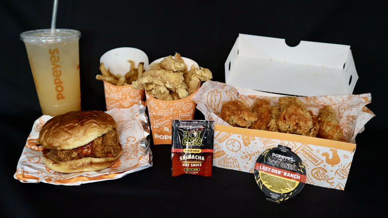 Popeyes Hot Ones sandwich, chicken, fries, drink, sauces