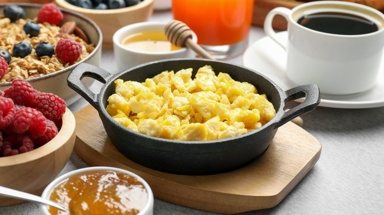 Scrambled eggs in a skillet.