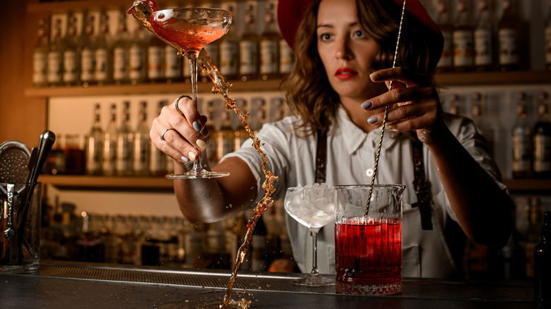bartender mixing in glass jar