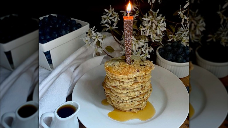 Chocolate candle in pancake stack