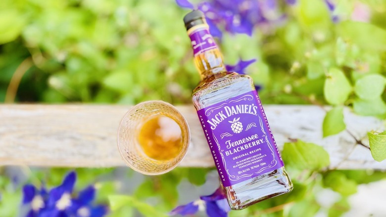 Overhead view of glass and bottle of Jack Daniel's Tennessee Blackberry Whiskey