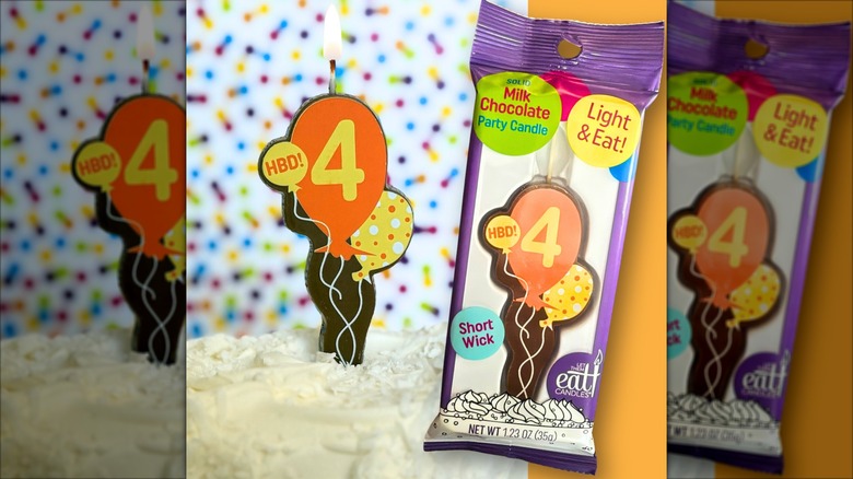 Edible balloon shaped candle on a cake