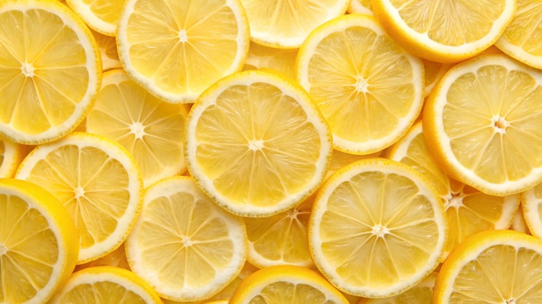 Full background of sliced fresh lemons