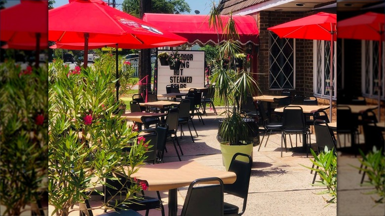 Schultz's Crab House outdoor terrace with red umbrellas