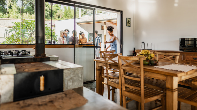 A kitchen with a sliding door