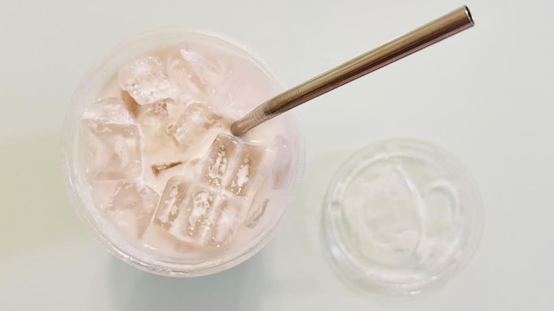 Overhead view of Sabrina's Strawberry Daydream Refresher with a metal straw