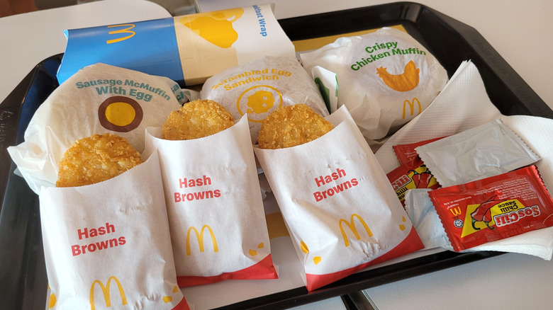 McDonald's breakfast including several hash browns.